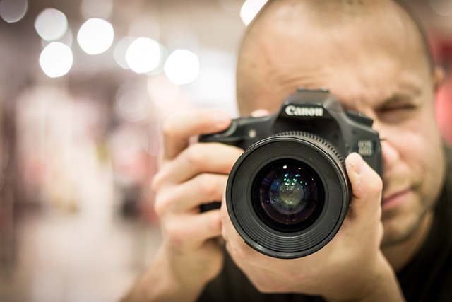 a camera held in a photographers hand